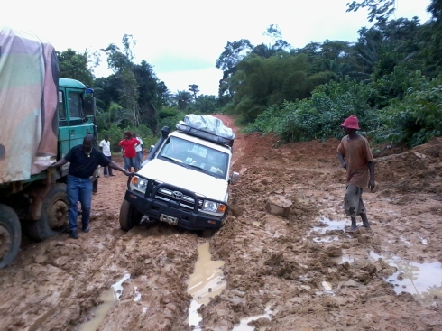 Children in Crisis / FAWE vehicle stuck in mud in Liberia